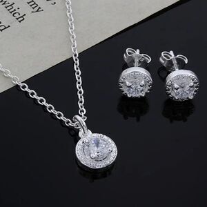 The Dainty Solitaire pendant necklace and stud earrings set in sterling silver